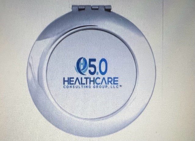 A compact mirror with the logo of 5. 0 healthcare consulting group, llc