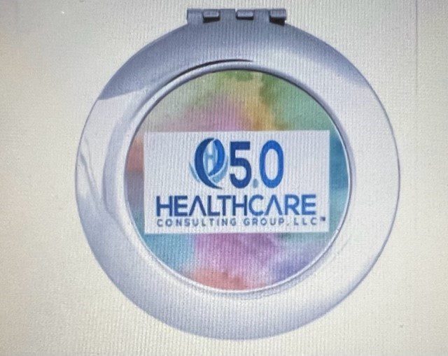 A compact mirror with the logo of healthcare consulting group.