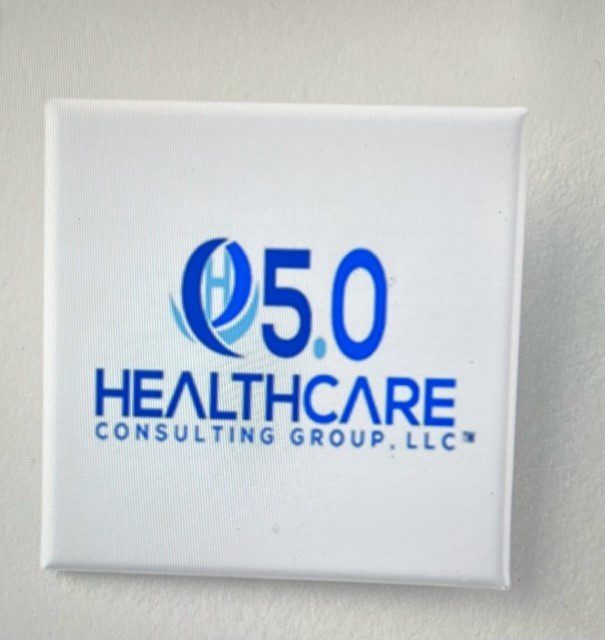 A square shaped button with the logo of healthcare consulting group.
