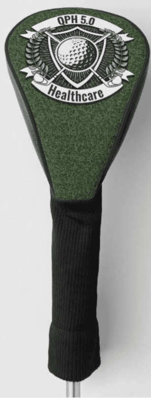 A golf club head cover with green grass on it.
