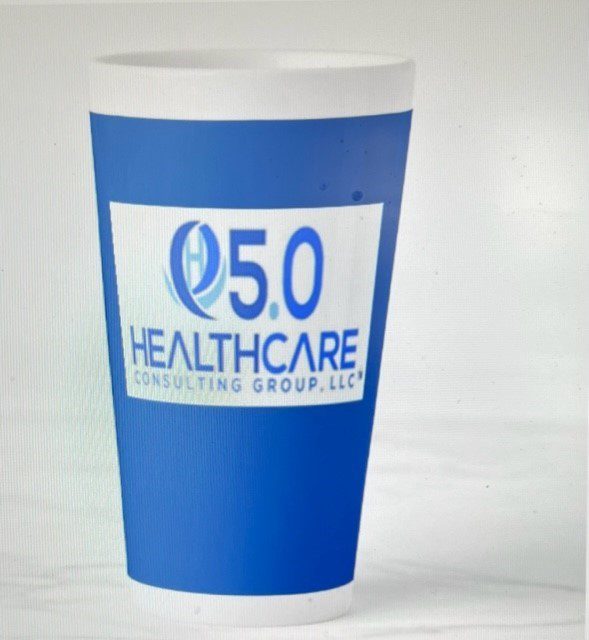 A cup that is sitting on the ground.